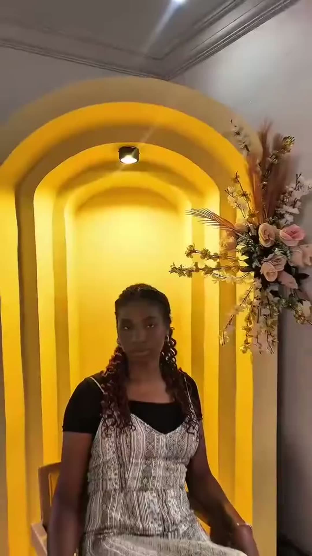 Golden arch alcove dressed with flowers